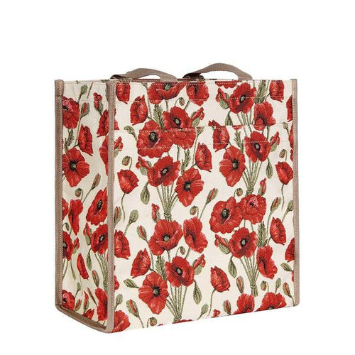 The image shows a square-fronted shopping bag embroidered with red poppies with black and green centres and green stems on a beige background. The bag has two woven fabric handles in light brown and light brown trim down both edges of the bag.